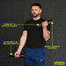 A man in a black shirt and blue pants holds Urban Fitness 2.5kg Adjustable Dumbbell Set. Yellow text highlights: compact & space saving, incremental adjustments, quick change system. Urban Fitness logo appears at the bottom right.
