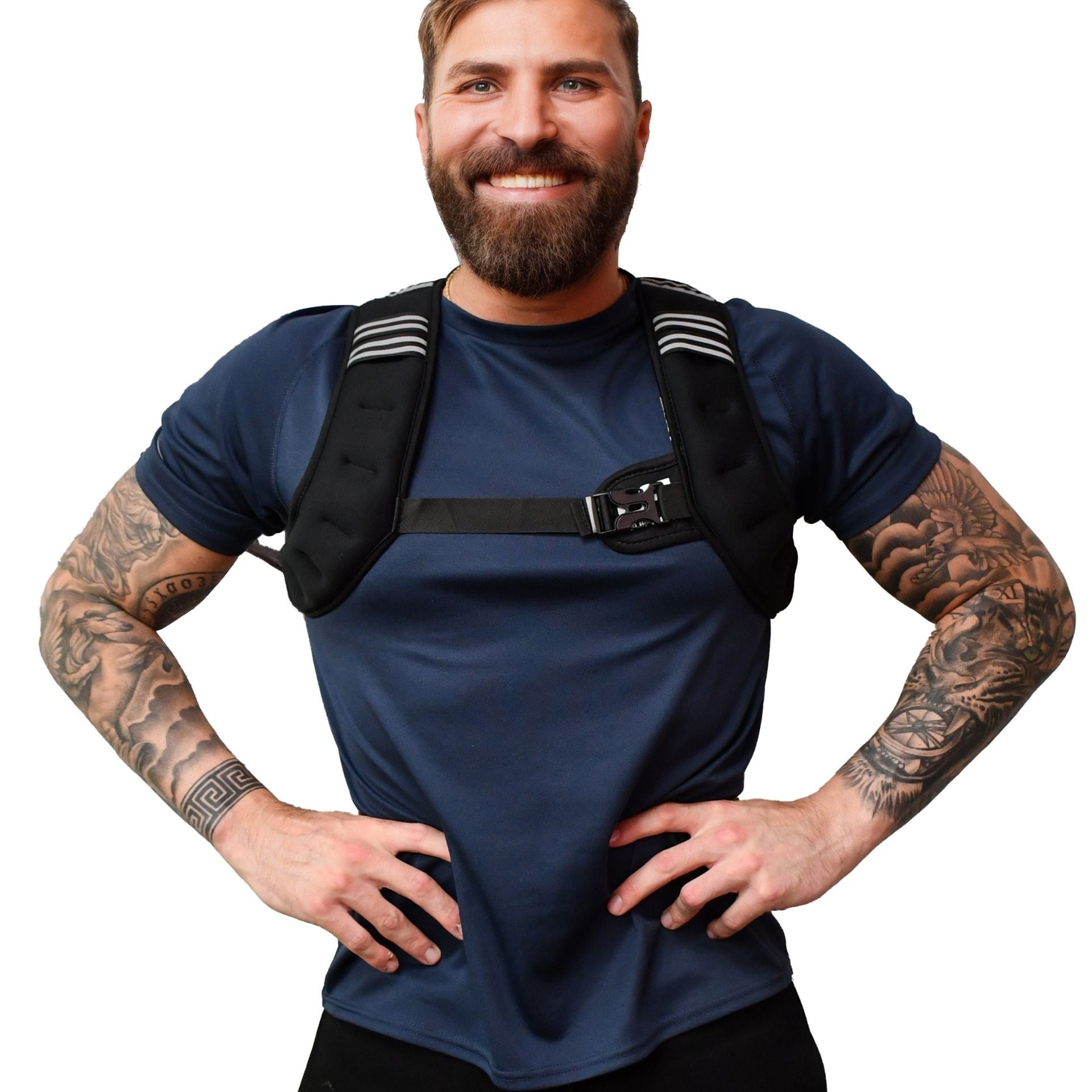 A smiling bearded man with tattooed arms stands hands on hips against a white background, wearing a navy shirt and the black Urban Fitness X Shape Weighted Vest by Urban Fitness, featuring striped shoulder pads.