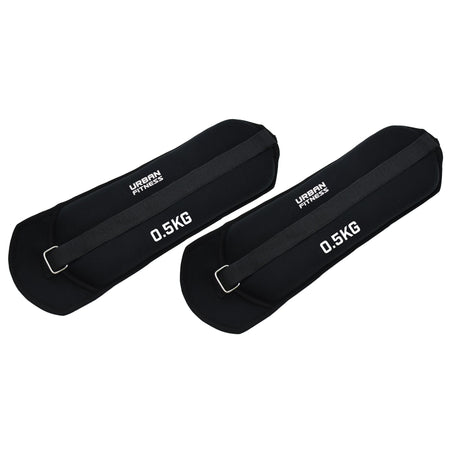 Two black Urban Fitness Neoprene Ankle/Wrist Weights (0.5 KG each) with adjustable straps and metal buckles are shown side by side on a white background.