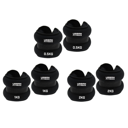 Five pairs of Urban Fitness Neoprene Ankle/Wrist Weights in 0.5kg, 1kg, and 2kg sizes are stacked together, each showing the Urban Fitness branding.