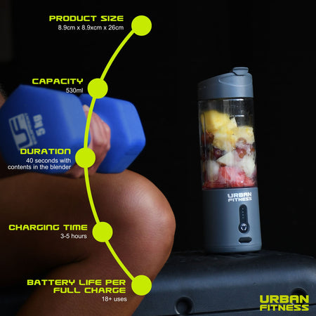 A blue Urban Fitness VitalFuse Portable Blender filled with fruit sits on a bench next to someone holding a blue dumbbell. Text highlights size, 500ml capacity, blending duration, 3-hour charging time, and long battery life. Urban Fitness logo appears in the corner.