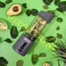 An Urban Fitness VitalFuse Portable Blender filled with avocado and greens rests on a green background amid spinach leaves, avocado halves, and other greens. "Urban Fitness VitalFuse Portable Blender" is displayed across the image.