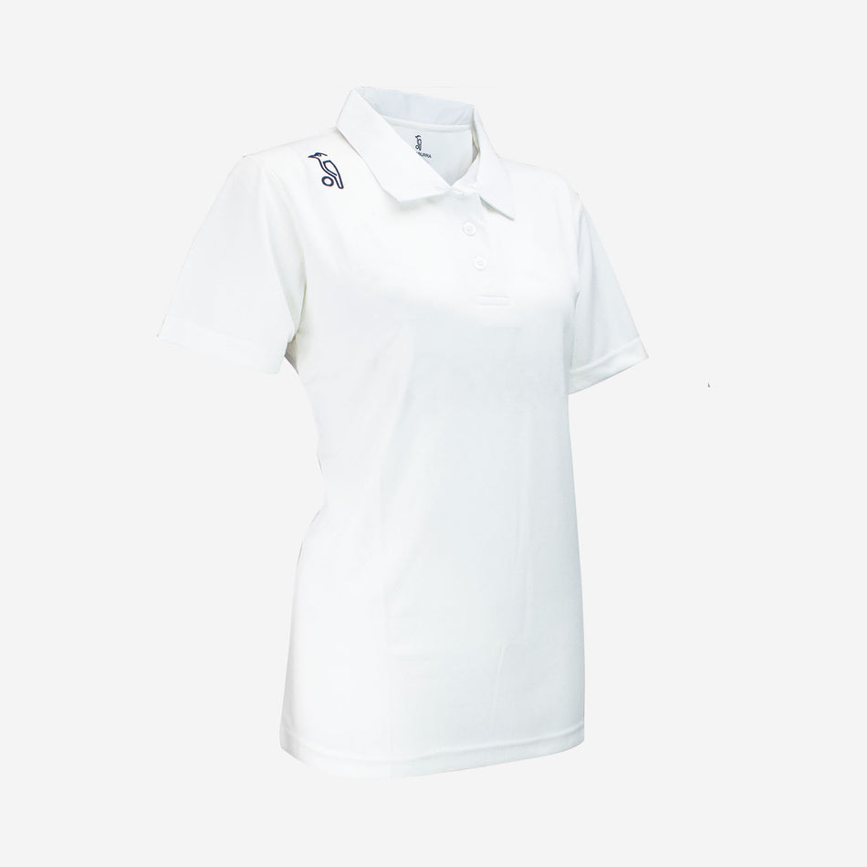 The Kookaburra Ladies Pro Player Cricket Shirt is a white, short-sleeve polo with a collar, buttons, and a subtle dark logo on the right shoulder. Made from stretch fabric and featuring Stay Cool Technology for lasting comfort.