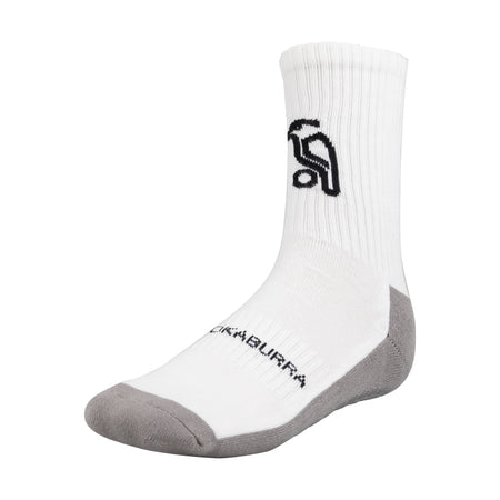 The Kookaburra Grip Socks are white with gray toes and heels, a cushioned sole, black abstract logo on the side, and KOOKABURRA across the foot. Ideal cricket socks by Kookaburra, shown on a plain white background.