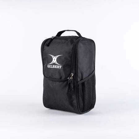 The Gilbert Club V4 Boot Bag by Gilbert is a black rectangular bag featuring a handle, zippered compartments, side mesh pocket, and the white GILBERT logo on the front, shown against a plain white background.