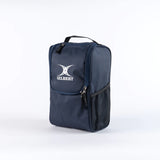 The Gilbert Club V4 Boot Bag by Gilbert, in navy, features a zippered top, front pocket, mesh side pocket, and black handle. The bag is shown against a plain white background.