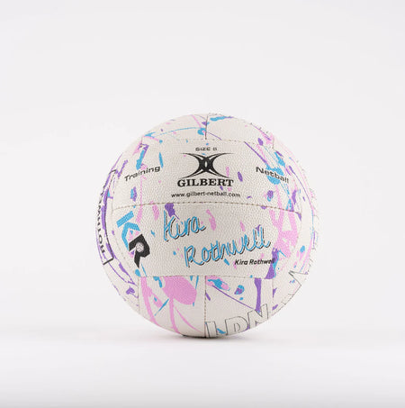 The Gilbert Ambassador Signature Netball by Gilbert is a size 5 white ball featuring vibrant blue, pink, and purple abstract patterns with “Kira Rothwell” printed on it—ideal as a signature ball against a plain white background.