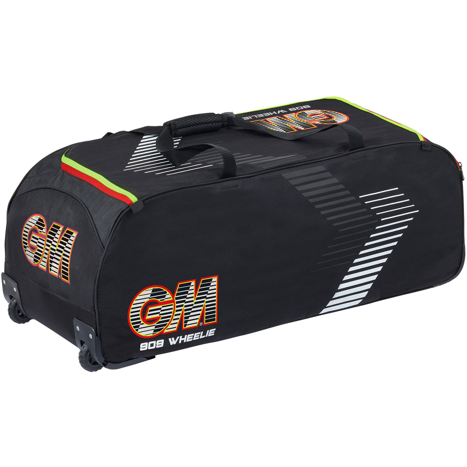 The Gunn & Moore 909 Wheelie 2026 is a large black cricket kit bag with GM and 909 Wheelie on its side, white diagonal stripes, green, red, and yellow accents near the zipper, and all-terrain wheels for easy transport.