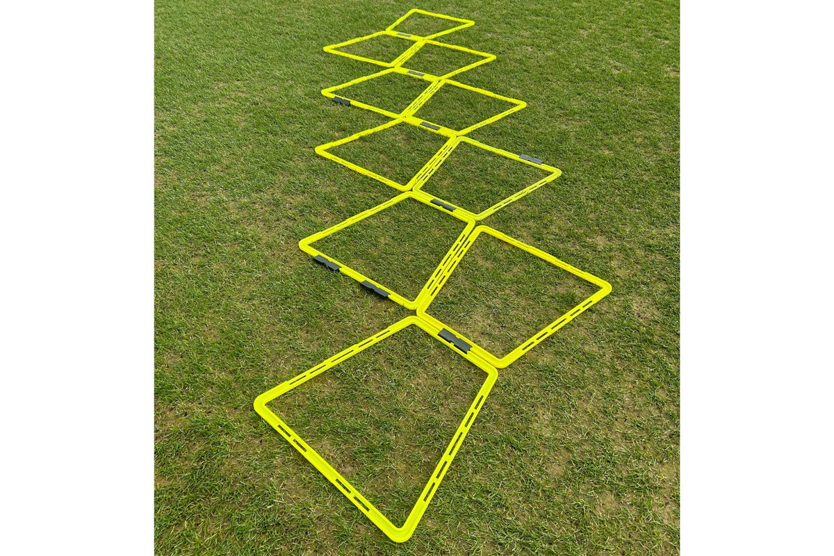 The Samba Sports Samba Pro Agility Trapeze Set, featuring yellow square rungs in a zigzag design on green grass, is essential training equipment to boost speed and coordination.