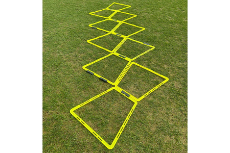 The Samba Sports Samba Pro Agility Trapeze Set, featuring yellow square rungs in a zigzag design on green grass, is essential training equipment to boost speed and coordination.
