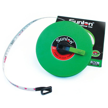 A Measuring Tape (Closed Case) by Martin Berrill Sports features a green Sunlon fibreglass reel, black and green handle, white tape, and comes in a matching box labeled 30m/100ft—ideal for those needing a durable measuring tape.