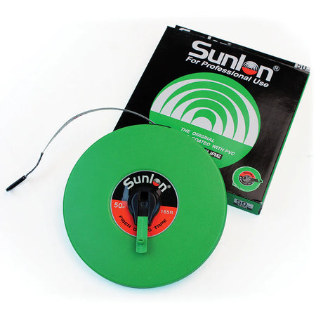 A Martin Berrill Sports Measuring Tape (Closed Case) in green is partially extended next to its black and green packaging. It features a handle, hook end, and durable closed case design for professional use.