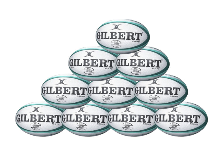 A pyramid of ten green Gilbert Atom Match Balls, designed for school and club rugby, each featuring the bold black GILBERT logo. Product: Gilbert Atom Match Ball Ten Pack.
