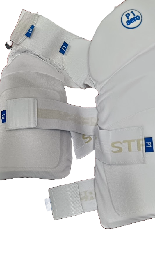 Close-up of Aero P1 Strippers V8 by Aero—white padded cricket lower body protection with EVA foam for extra hip safety, adjustable straps, and blue P1/P1 aero labels, shown on a light background.