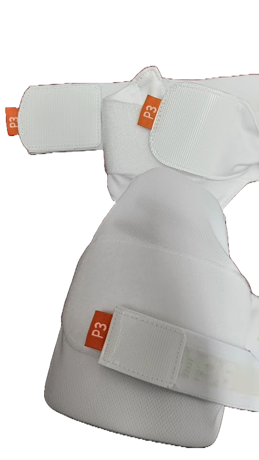 Close-up of Aero P3 Strippers V8, white padded lower body sports guards with orange P3 tags. Designed for cricket by Aero, these guards feature Velcro straps for adjustable fit and offer ultimate protection.