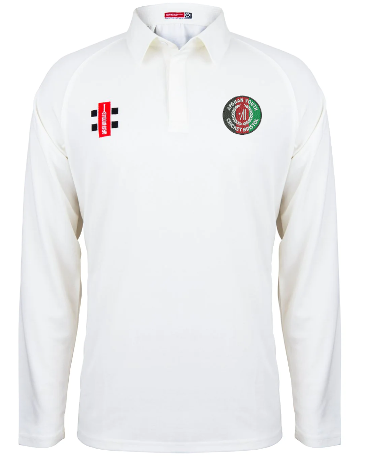 The Gray Nicolls Afghan Youth Cricket Bristol CC Matrix V2 Long Sleeve Cricket Shirt is white with a collar, a green and red club logo on the left chest, and two rectangular black, white, and red badges on the right chest.