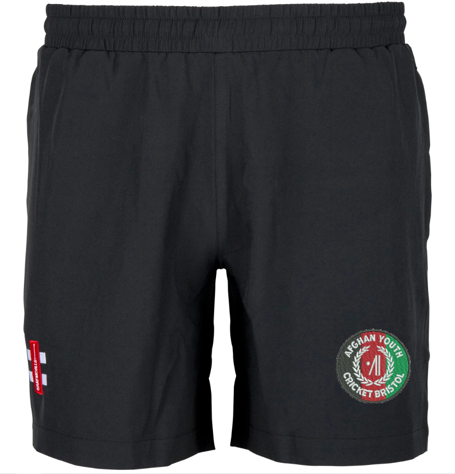 The Gray Nicolls Afghan Youth Cricket Bristol CC Velocity Shorts feature an elastic waistband, a Bristol circular logo on the left leg, and a red, white, and blue patch on the right—ideal for cricket training.