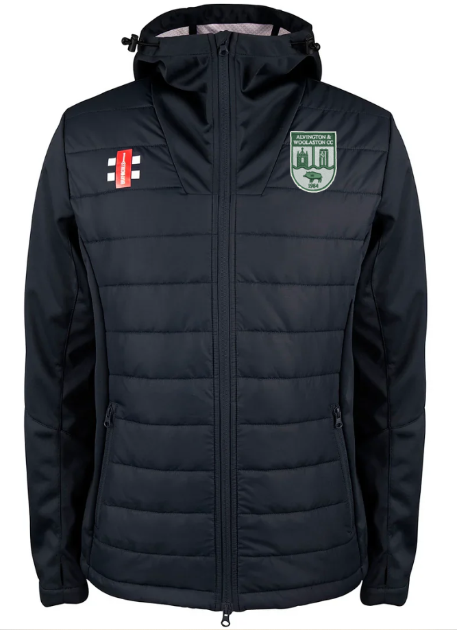The Gray Nicolls Alvington & Wollaston CC Pro Performance Jacket is a black full zip hoodie with two right chest logos, a green and white Ards Forest Park badge on the left chest, front pockets, and a sleek sporty design.