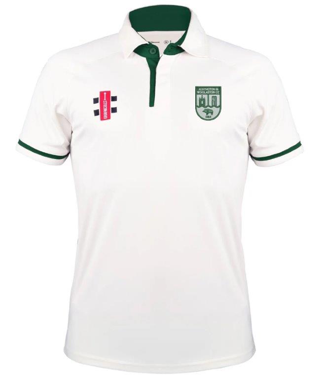 The Gray Nicolls Alvington & Woolaston CC Pro Performance V3 Short Sleeve Shirt is white with dark green trim on the collar and sleeves, featuring a red and black logo, plus a green crest with a building and animal on the chest.