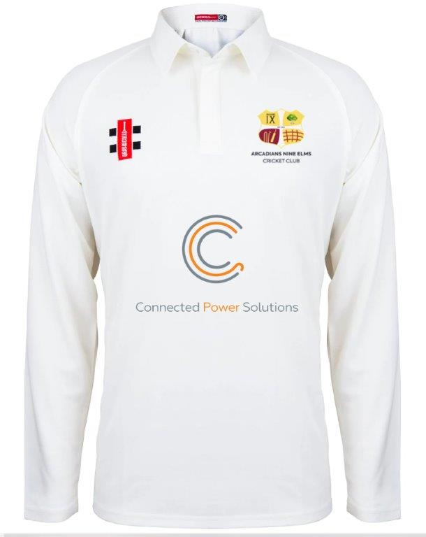 The Gray Nicolls Arcadians Nine Elms CC Matrix V2 Long Sleeve Cricket Shirt is a white top with moisture control, sponsor logos like Connected Power Solutions on the chest, and the club’s crest on the left side.