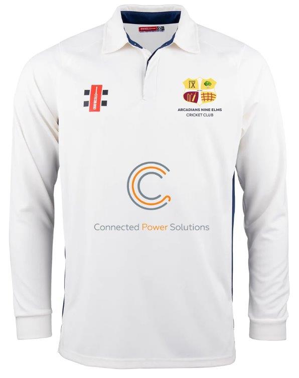 The Gray Nicolls Arcadians Nine Elms CC Pro Performance V2 L/S Cricket Shirt in Ivory/Navy features a collared, buttoned neckline and multiple front logos, including the club badge, sponsors, and 'Connected Power Solutions' beneath a circular logo.