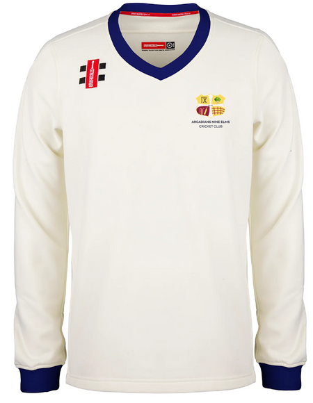 The Gray Nicolls Arcadians Nine Elms CC Pro Performance Sweater is a long-sleeved white cricket sweater with blue trim, featuring the club crest, sponsor logos, and a red label on the chest.