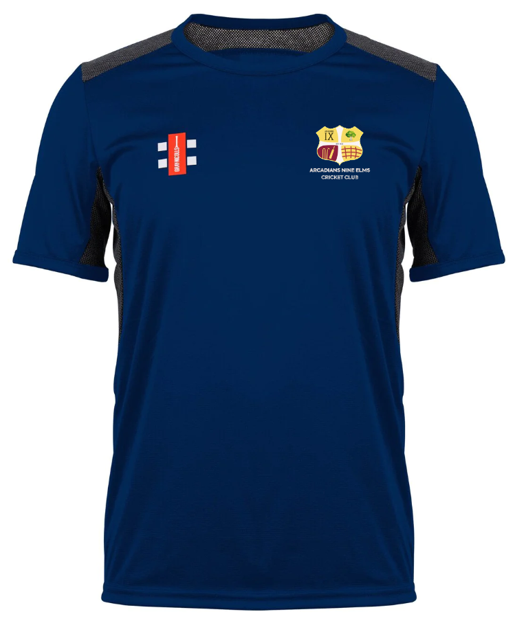 The Gray Nicolls Arcadians Nine Elms CC Pro Performance T-Shirt is a blue, short-sleeve cricket jersey with black side panels, a red rectangular logo and white icon on the left chest, and a multicolored crest with text on the right.