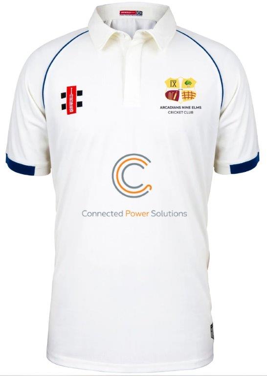 The Gray Nicolls Arcadians Nine Elms CC Matrix V2 Short Sleeve Match Shirt features blue trim, sponsor logos including Connected Power Solutions, club crest, and is made from breathable polyester with a buttoned collar for comfort.