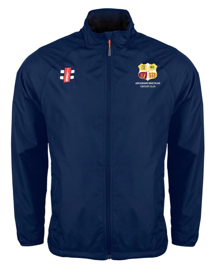 The Gray Nicolls Arcadians Nine Elms CC Velocity Rain Jacket is a navy blue zip-up with cricket-themed chest logos, high collar, and long sleeves—ideal for fans seeking a stylish cricket rain jacket.