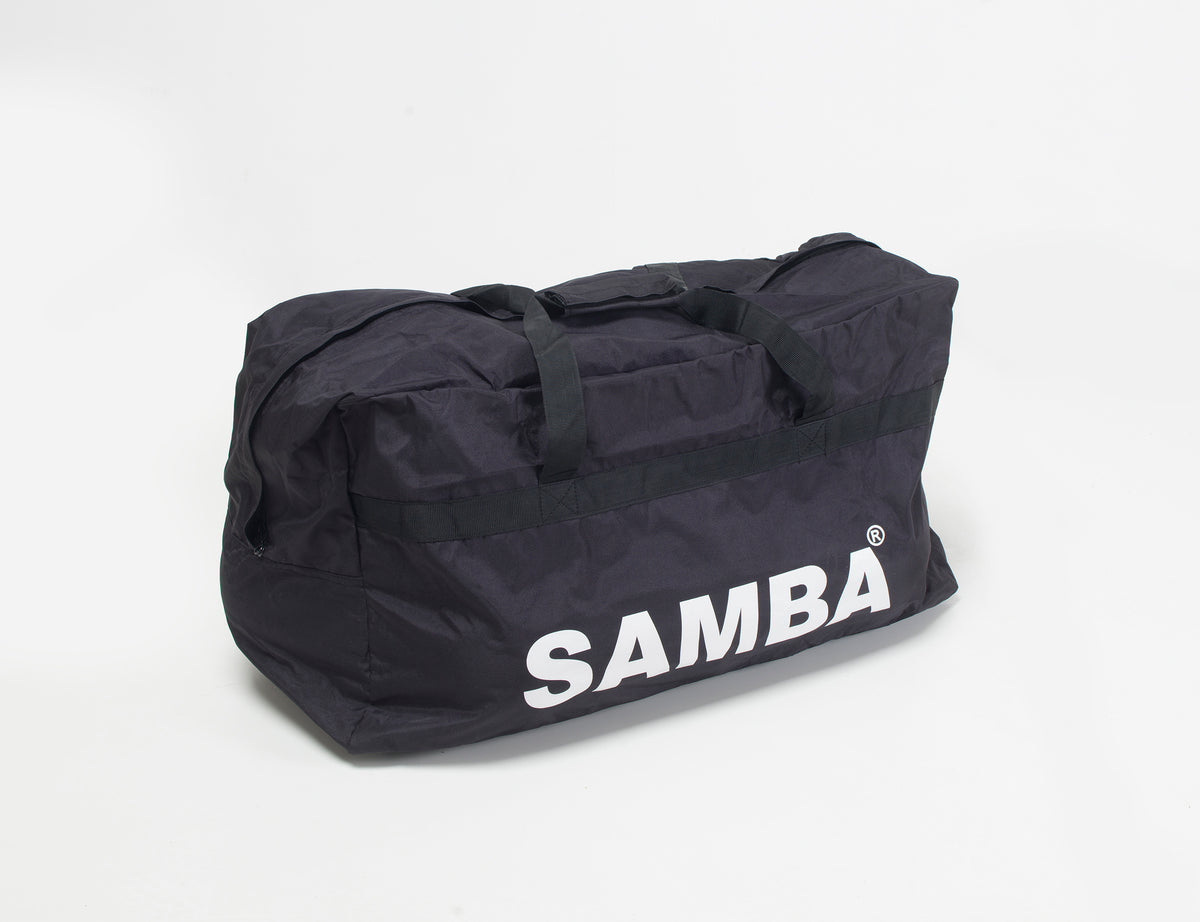 The Samba Sports Samba Team Kit Bag is a large black equipment bag with two handles, bold white "SAMBA" lettering on the side, and high-capacity storage, shown against a plain white background.