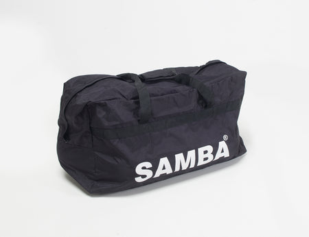 The Samba Sports Samba Team Kit Bag is a large black equipment bag with two handles, bold white "SAMBA" lettering on the side, and high-capacity storage, shown against a plain white background.