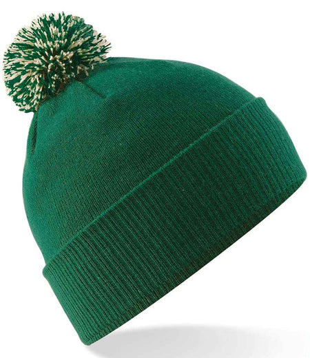 The Kingswood Village CC Snowstar Beanie (Bottle/Off White) by Martin Berrill Sports, with a folded brim and green and white pom-pom, featuring the Club Logo, is shown against a white background.