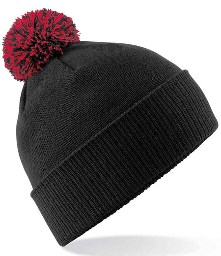 The Custom Branded Bobble Hat by Martin Berrill Sports features black knit, a thick folded brim, and a red-and-black pom-pom, displayed on a white background.