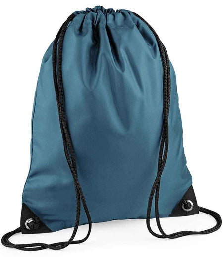 The PenCarrie BagBase Premium Gymsac in Airforce Blue features black drawstrings, reinforced black corners with metal grommets, and water-resistant fabric—a stylish choice set against a white background.