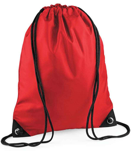 The PenCarrie BagBase Premium Gymsac in bright red features black drawcords, water-resistant fabric, and reinforced black corners with metal grommets, shown on a plain white background.