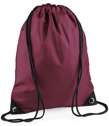 The PenCarrie BagBase Premium Gymsac in burgundy features black drawcords and metal grommets at the bottom corners, showcased against a plain white background.