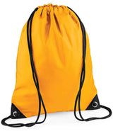 The PenCarrie BagBase Premium Gymsac in gold features black drawstrings and reinforced black corners, displayed against a white background.