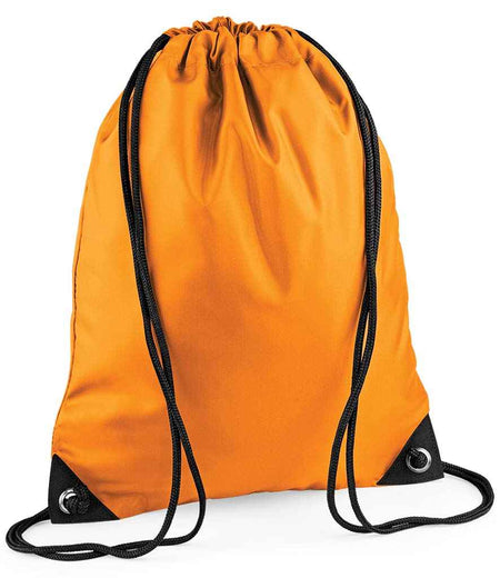 The PenCarrie BagBase Premium Gymsac is a bright orange, water-resistant drawstring bag with black strings and reinforced black corners with metal grommets, shown standing upright on a white background.