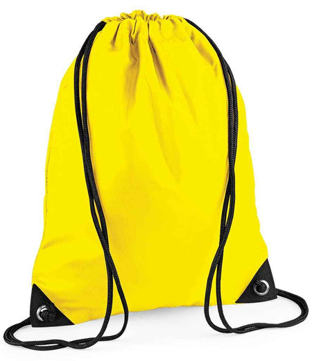 The PenCarrie BagBase Premium Gymsac, a bright yellow water-resistant drawstring bag with black strings, reinforced corners, and metal grommets, is shown against a white background.