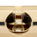 Close-up view of the inside of a beige plastic model boat, highlighting two black rubber components and a central screw with a metallic support structure—details reminiscent of the precise interior mechanisms featured in the Bola Hockey Machine by Bola.