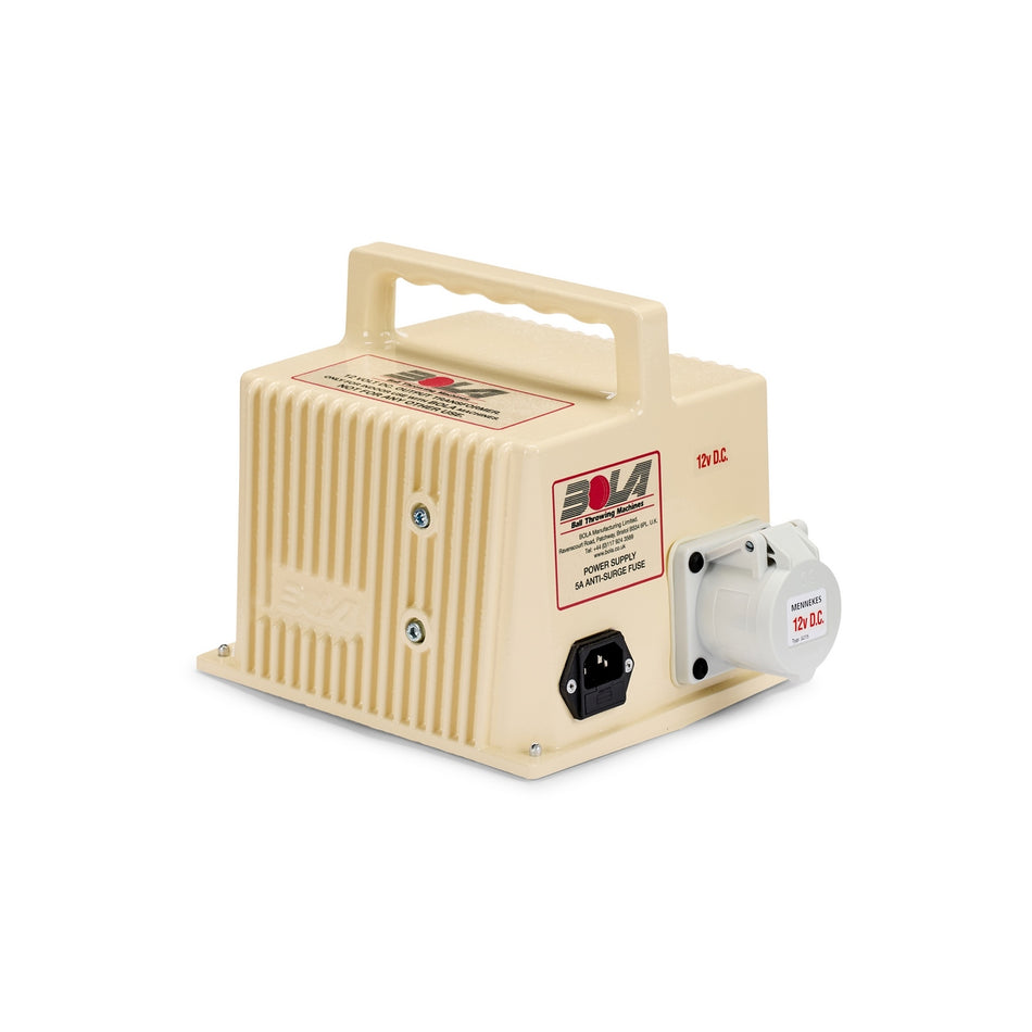 Beige, rectangular Bola Power Supply unit by Bola, featuring a convenient handle and a front control panel labeled “12V DC.” Equipped with a black power switch, input socket, and a white 12V output socket on the right side. Designed as a high amperage transformer ideal for use as a bowling machine transformer.