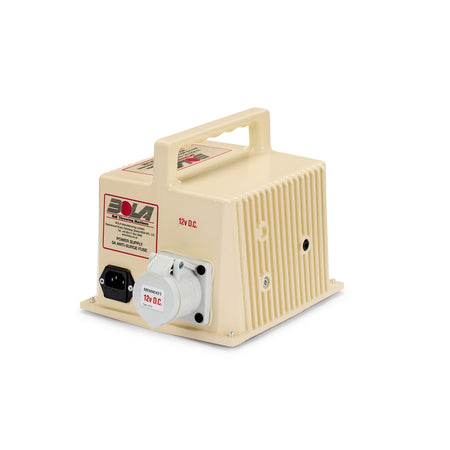 The Bola Power Supply by Bola is a beige 12V DC unit featuring a handle, ventilation slats, power socket, and control switch, with the “Bola” label displayed on the front. Designed as a high amperage transformer, it is ideal for use as a bowling machine transformer, ensuring reliable performance and lasting durability.