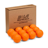 A cardboard box labeled "Bola Bowling Machine Balls - 12 Pack" from the Bola brand is shown behind twelve orange, dimpled training balls, neatly arranged in front of the box.