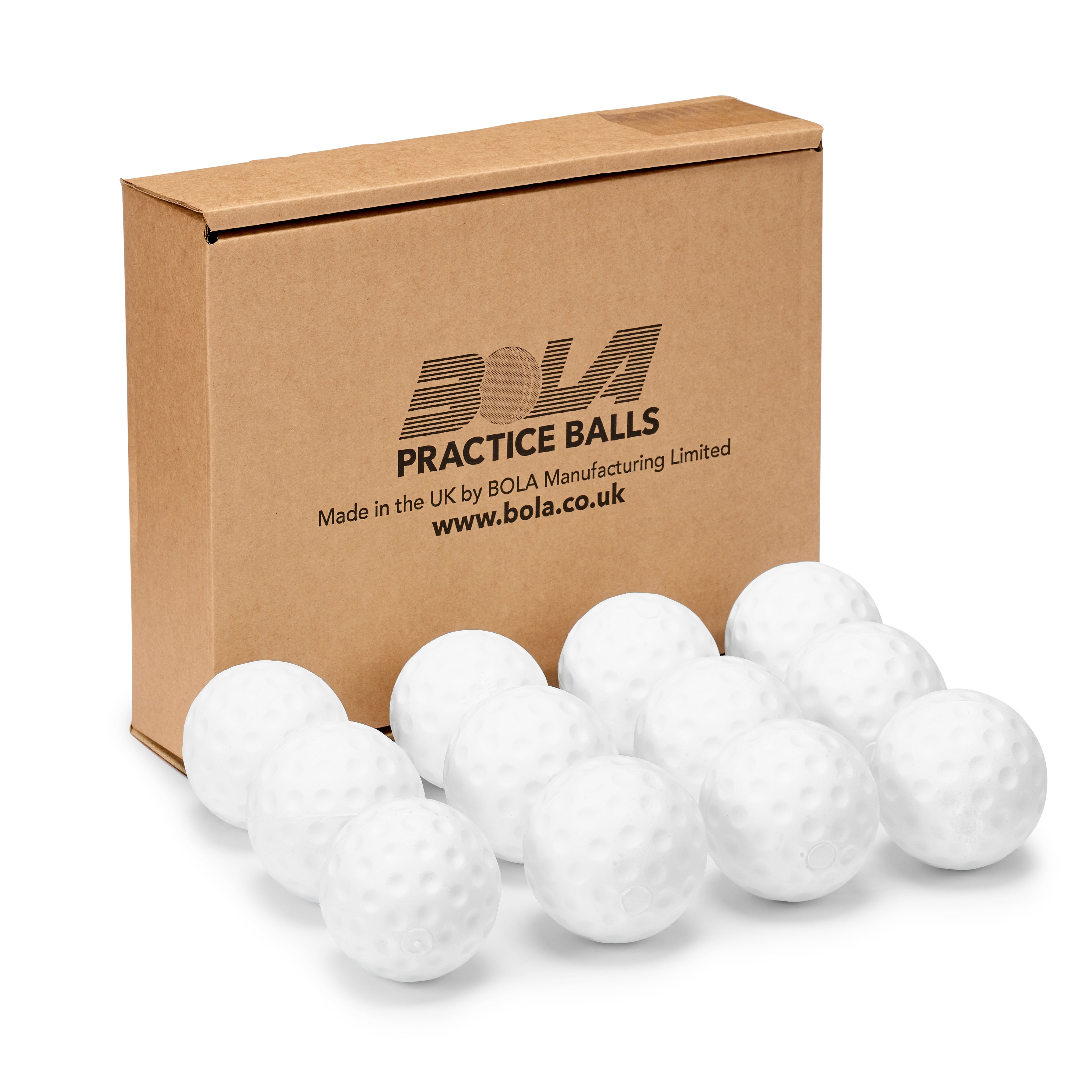 A cardboard box labeled "Bola" is displayed behind twelve white Bola Bowling Machine Balls with dimpled surfaces, neatly arranged in front of the box—ideal for cricket training. This 12 pack from Bola is perfect for practice sessions.