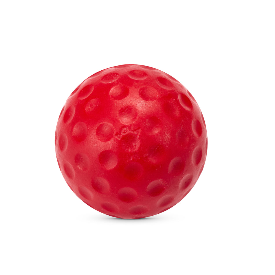 A Bola Bowling Machine Ball by Bola, featuring a red color and a dimpled surface reminiscent of a golf ball, shown against a white background—perfect for use with Bola bowling machines or as practice balls for cricket training sessions.