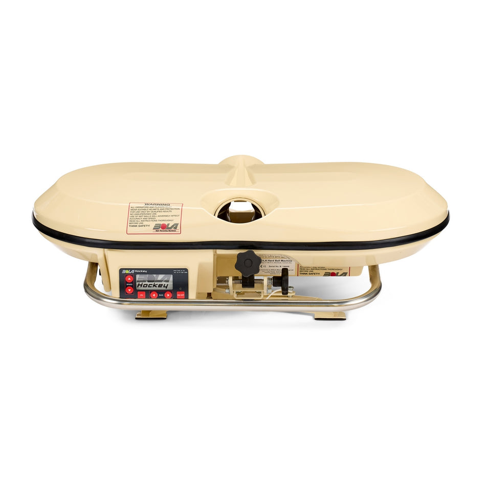 Gather around the Bola Hockey Machine by Bola after your hockey practice—the ideal tabletop gas grill with a closed lid, control knobs, and front safety labels set on sturdy metal legs, making it perfect for team meals or post-practice hangouts following an intense session with your training equipment out on the rink.