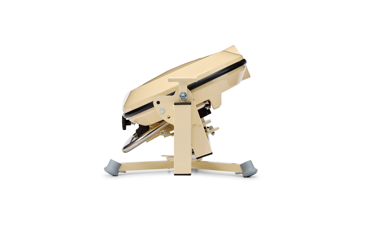 Beige, industrial-looking Bola Fielding Training Machine with a metal base and angled top, positioned on a white background. Reminiscent of the sturdy design characteristic of Bola machines, it features gray foot pads and appears to be adjustable.