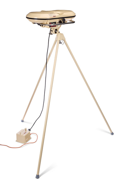 A beige, round electric grill stands on a tall, three-legged metal tripod. Much like the robust build of the Bola Professional Bowling Machine by Bola—designed for cricket batting practice—its construction ensures both stability and reliable performance. An attached power cord connects to a small, rectangular control box on the floor.