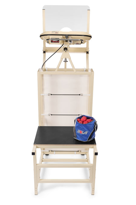 A table tennis robot machine with a net, control panel, and a basket of ping pong balls on a bench in front of it is positioned next to the Bola Bowling Machine Stand on Wheels by Bola, providing added convenience during practice sessions.