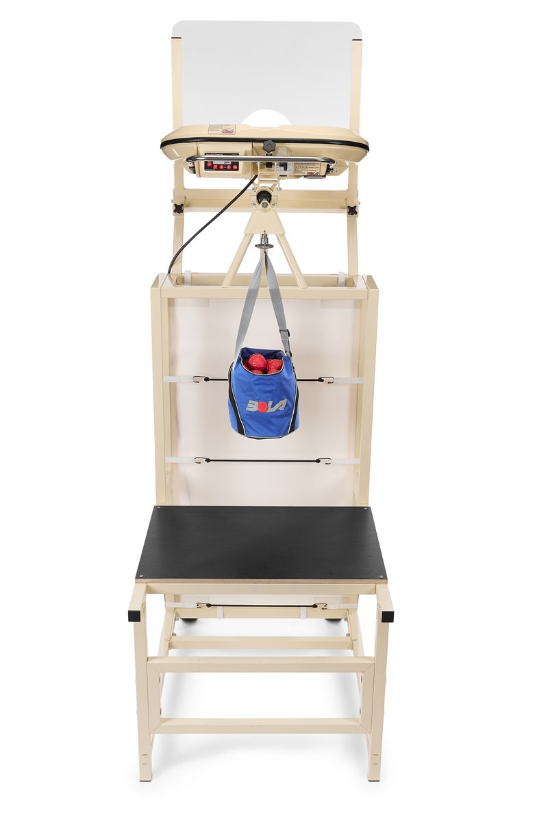 A beige medical testing station featuring a black bench, adjustable platform, hanging blue bag with red balls, and white backboard is positioned next to the Bola Bowling Machine Stand on Wheels by Bola, seamlessly blending function and versatility in the space.
